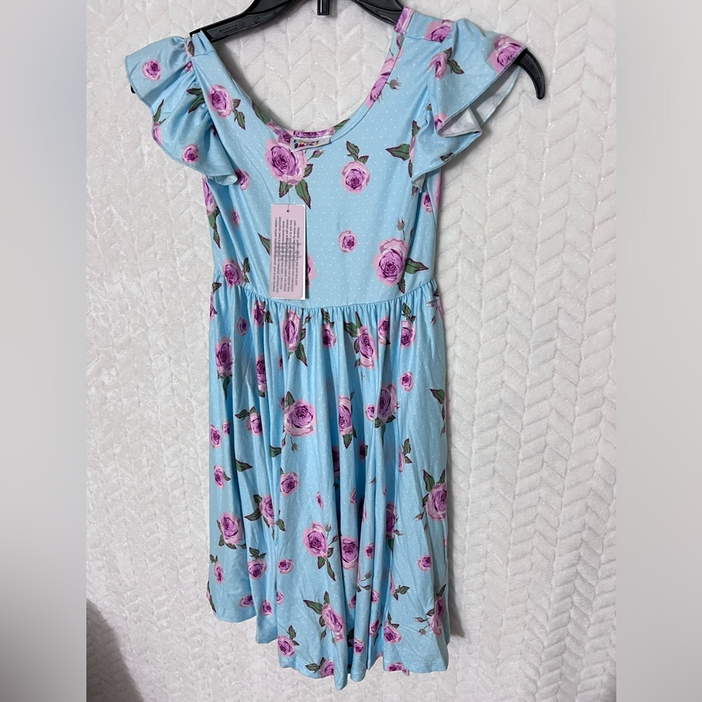 Hermoso vestido casual celeste con flores size 7